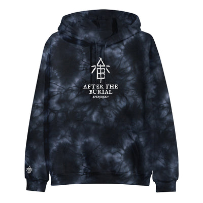 Image of the front of a black and blue crystal wash hooded sweatshirt against a white background. The center of the hoodie features the ATB logo- It looks like sticks that are laid out to make the letters ATB in a descending order. This is in white. Below this in white is the text "after the burial". Below that is the text "evergreen". The right bottom of the sleeve also has a small after the burial logo in white.
