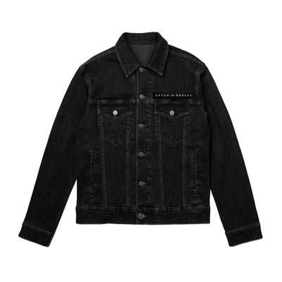 Image of the front of a black denim jacket against a white background. The jacket is button up, and has two pockets on the chest. Above the left chest pocket in white text reads "after the burial".
