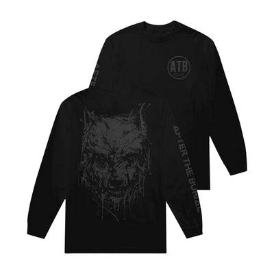 Image of the front and back of a black longsleeve against a white background.  The left chest in a dark grey print says ATB and has a circle outline around it. there are small coordinates below the ATB. The right sleeve says "after the burial" in a descending text in dark grey. The back of the longsleeve features a graphic of a wolf's face, teeth bearing. This is also in a dark grey color. 